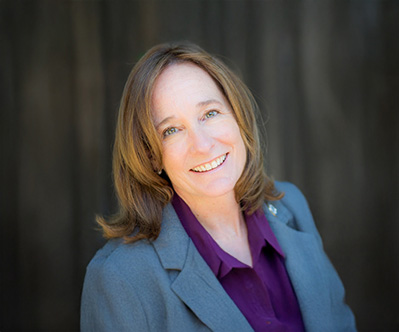 BettyKay Pilcher smiling in a blue blazer